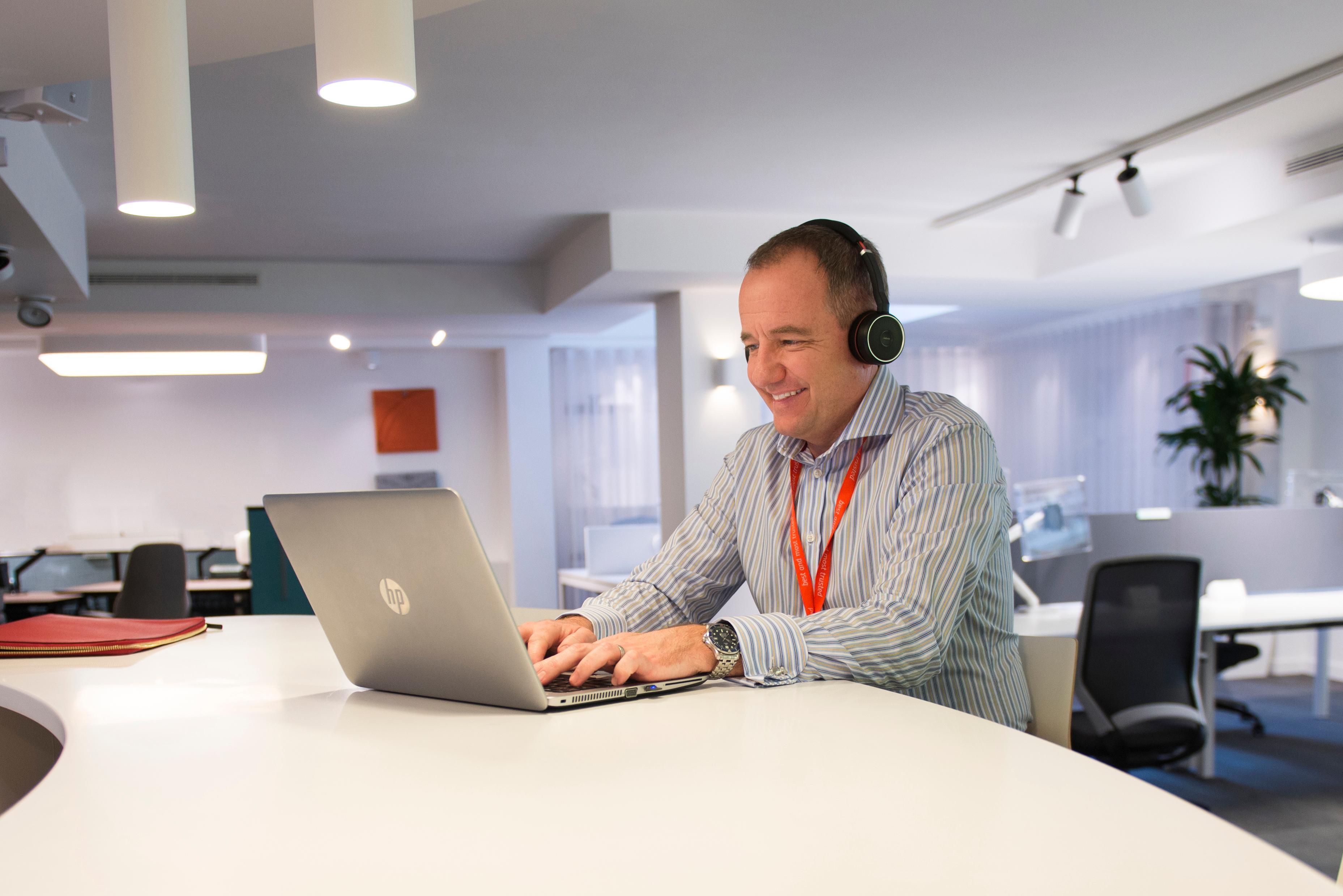 Individual Work Headset Male Laughing 1